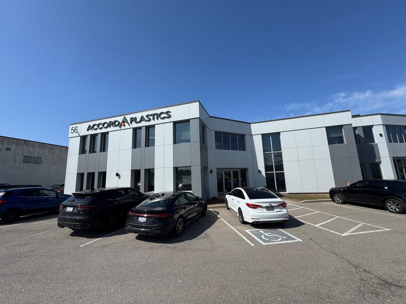 Two-storey commercial building exterior with film on every window