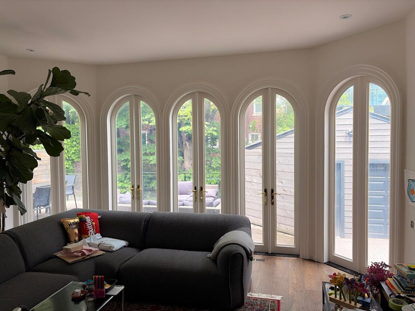Living room with five arched French doors, film installed with the view fully preserved